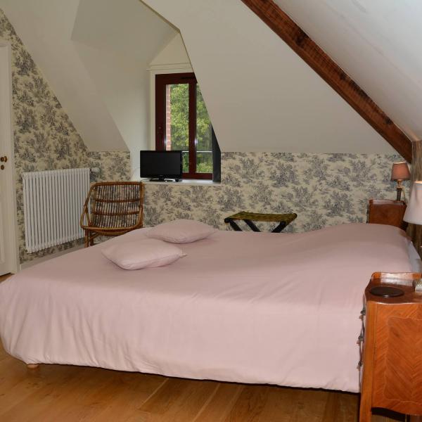 Lit de la chambre d'hôtes 