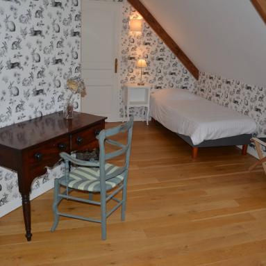 Lit de la chambre d'hôtes 